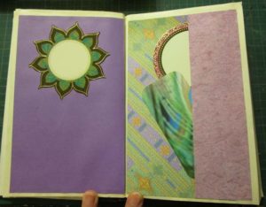 Peacock book pages with tuck space and tags on right.